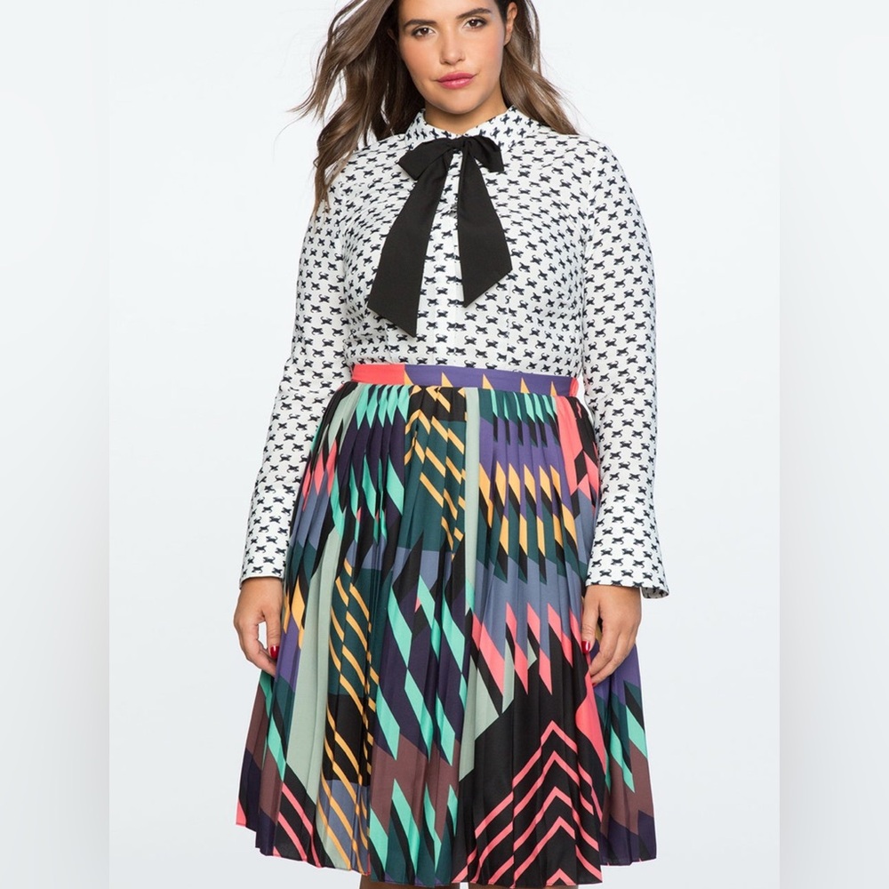 Eloquii multi print dress. Lost the bowtie. 
Super cute! 
Size 18
